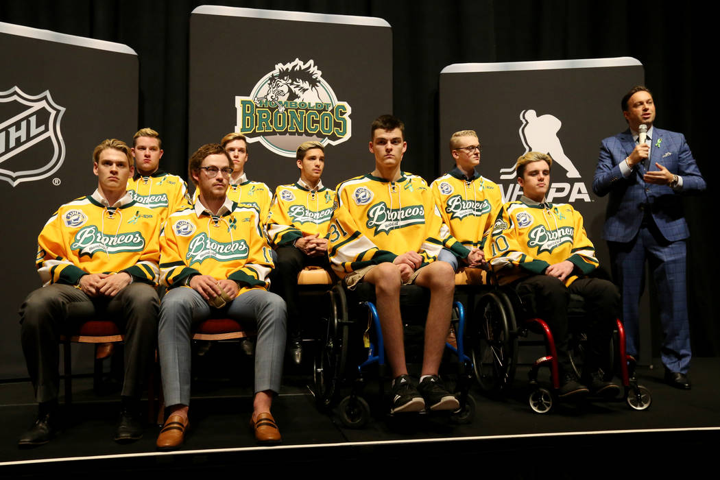 Elliotte Friedman from SportsNet, right, introduces the Humboldt Broncos at the Encore at Wynn Las Vegas Tuesday, June 19, 2018. The Broncos are, from left, Matthieu Gomercic, Derek Patter, Tyler ...