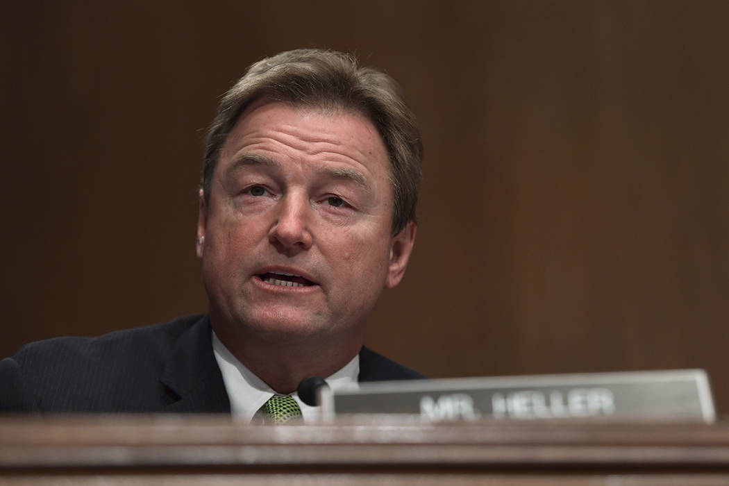 Sen. Dean Heller, R-Nev., asks a question of Treasury Secretary Steven Mnuchin during a Senate Banking Committee hearing on Capitol Hill in Washington, Tuesday, Jan. 30, 2018, on the Financial Sta ...