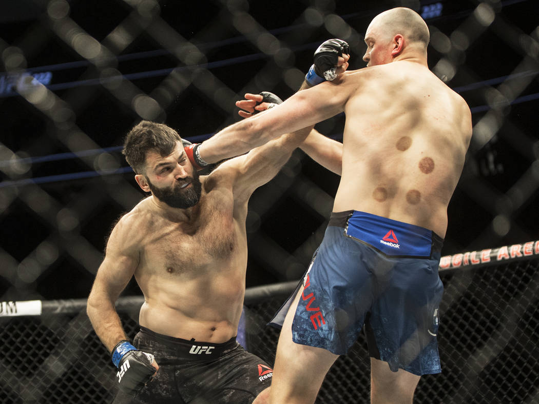Andrei Arlovski, left, connects with a left hook against Stefan Struve during their heavyweight matchup at UFC 222 at T-Mobile Arena on Saturday, March 3, 2018, in Las Vegas. Arlovski beat Struve ...
