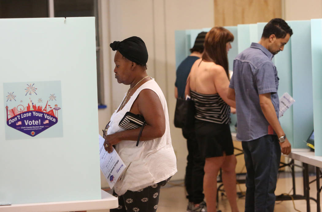 Voters cast their vote during Tuesday's primary election at a polling station at Kenny G. Guinn Middle School on June 12, 2018, in Las Vegas Bizuayehu Tesfaye/Las Vegas Review-Journal @bizutesfaye