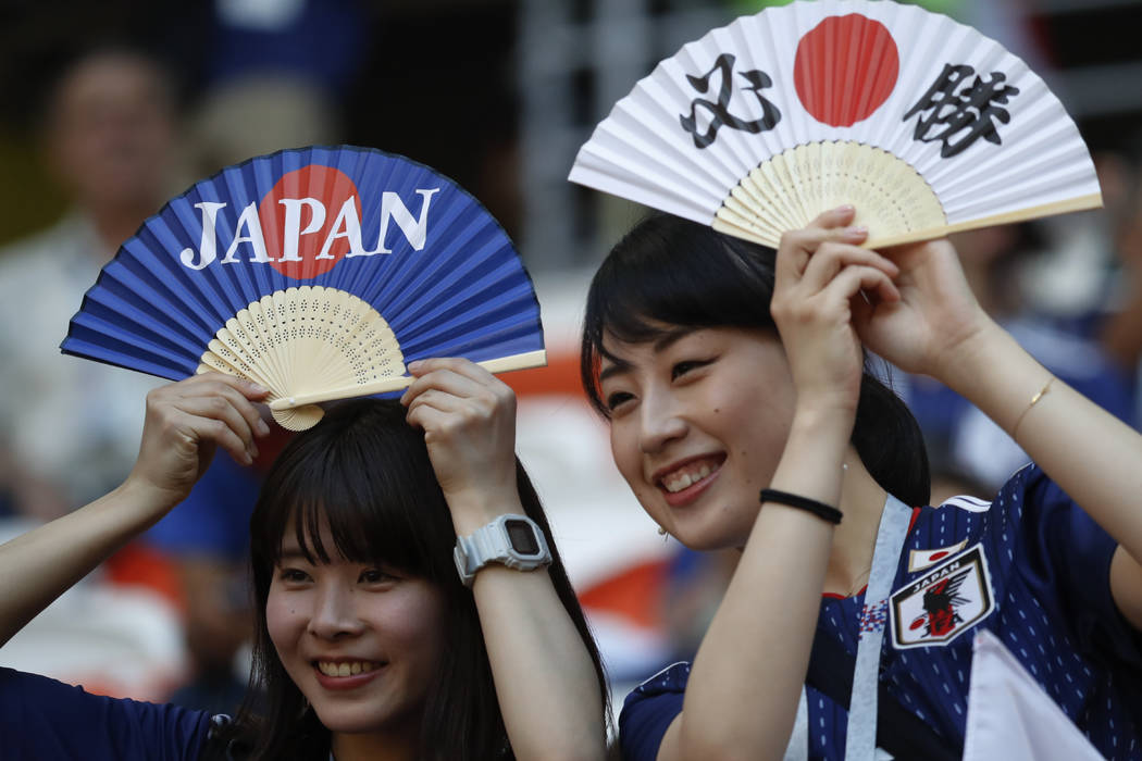 Japan's supporters hold fans prior to the group H match between Colombia and Japan at the 2018 soccer World Cup in the Mordavia Arena in Saransk, Russia, Tuesday, June 19, 2018. (AP Photo/Eugene H ...