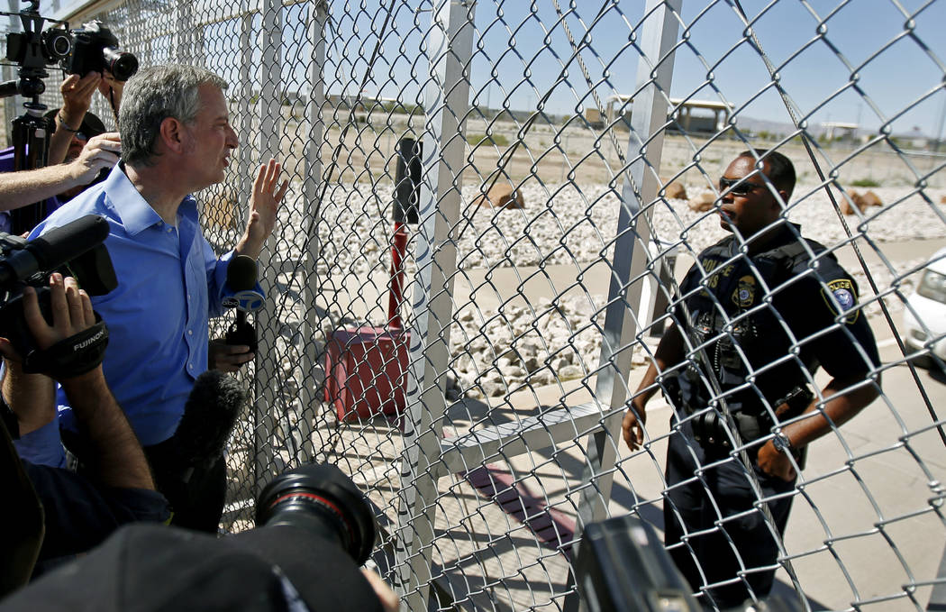 New York City Mayor Bill de Blasio, left, requests entrance to the holding facility for immigrant children in Tornillo, Texas, near the Mexican border, Thursday, June 21, 2018. About 20 mayors fro ...