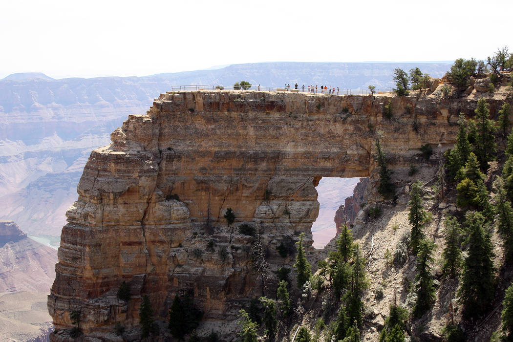 Hikers stand above Angels Window just a five minute hike from Cape Royal Road at the North Rim of the Grand Canyon in Arizona. (Deborah Wall/Las Vegas Review-Journal)