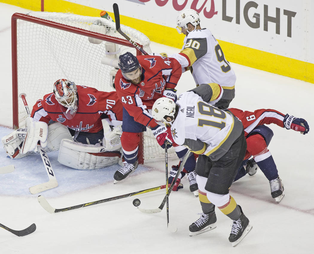 Capitals goaltender Braden Holtby (70) makes a second-period save against Golden Knights left wing James Neal (18) during Game 4 of the NHL Stanley Cup Final on Monday, June 4, 2018, at Capital On ...