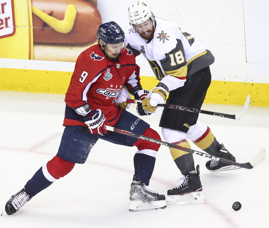 Washington Capitals defenseman Dmitry Orlov (9) and Golden Knights left wing James Neal (18) battle for the puck during the second period of Game 4 of the Stanley Cup Final at Capital One Arena in ...