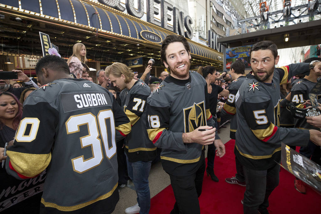 Golden Knights players Malcolm Subban (30), William Karlsson (71), James Neal (18) and Deryk Engelland (5) greet fans during the team's first fan fest at the Fremont Street Experience in downtown ...