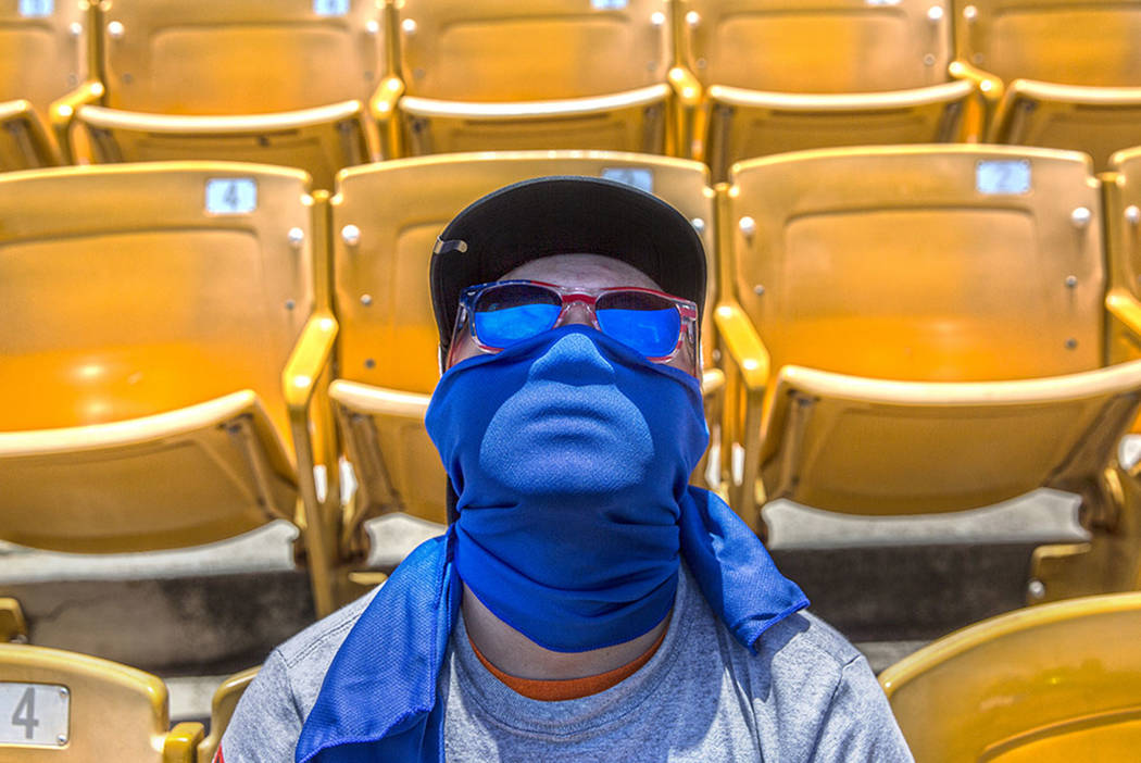 51s fan T.J. Leger watches Las Vegas take on the Reno Aces in mid-day temperatures reaching 106 degrees on Sunday, June 24, 2018, at Cashman Field, in Las Vegas. (Benjamin Hager Las Vegas Review-J ...