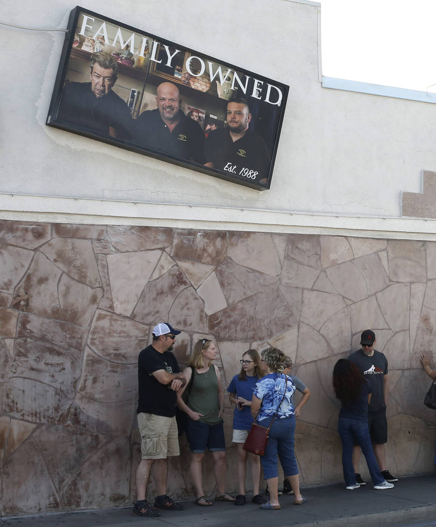 People wait in line to enter the Gold and Silver Pawn Shop in Las Vegas on Monday, June 25, 2018, in Las Vegas. Bizuayehu Tesfaye/Las Vegas Review-Journal @bizutesfaye