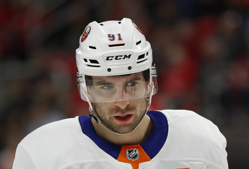 New York Islanders center John Tavares (91) plays against the Detroit Red Wings in the first period of an NHL hockey game Saturday, April 7, 2018, in Detroit. (AP Photo/Paul Sancya)