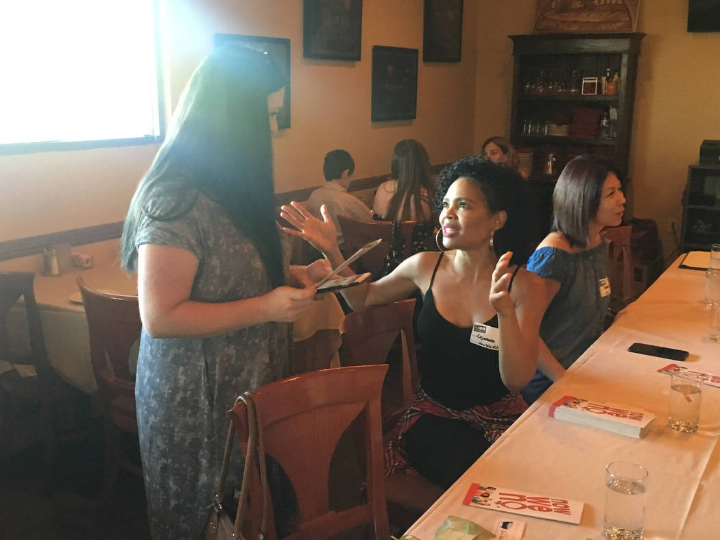 Lajuanna Burrell, right, chats with Wendy Pennington, senior executive director of One Hope Winery, at the Henderson MOB chapter launch at Tuscany Grill at 11105 S. Eastern Ave. on June 27. (Baile ...