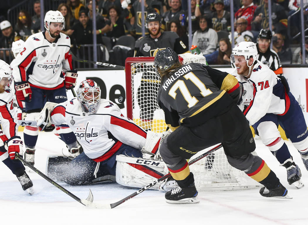 Golden Knights center William Karlsson (71) scores a goal past Washington Capitals goaltender Braden Holtby (70) during the first period of Game 1 of the NHL hockey Stanley Cup Final at the T-Mobi ...