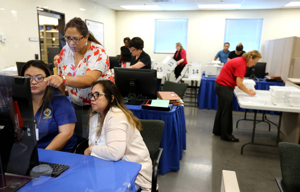 Clark County election workers conduct a recount of the Democratic primary for the County Commission District E seat at election headquarters in Las Vegas Tuesday, June 26, 2018. K.M. Cannon Las Ve ...