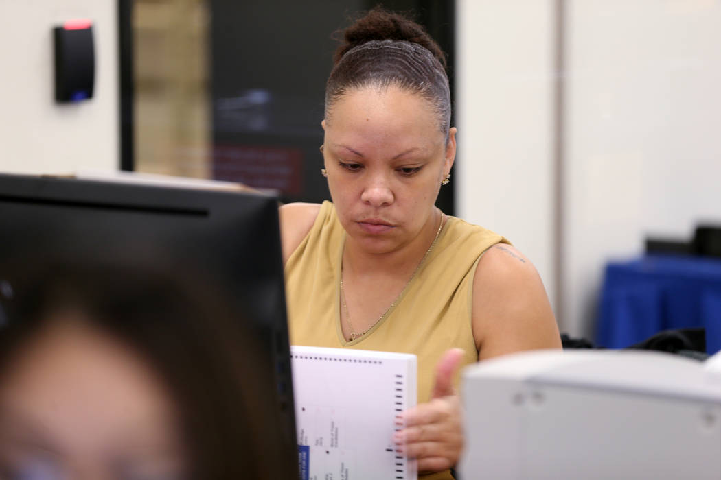 A Clark County election worker counts mail-in ballots during a recount of the Democratic primary for the County Commission District E seat at election headquarters in Las Vegas Tuesday, June 26, 2 ...