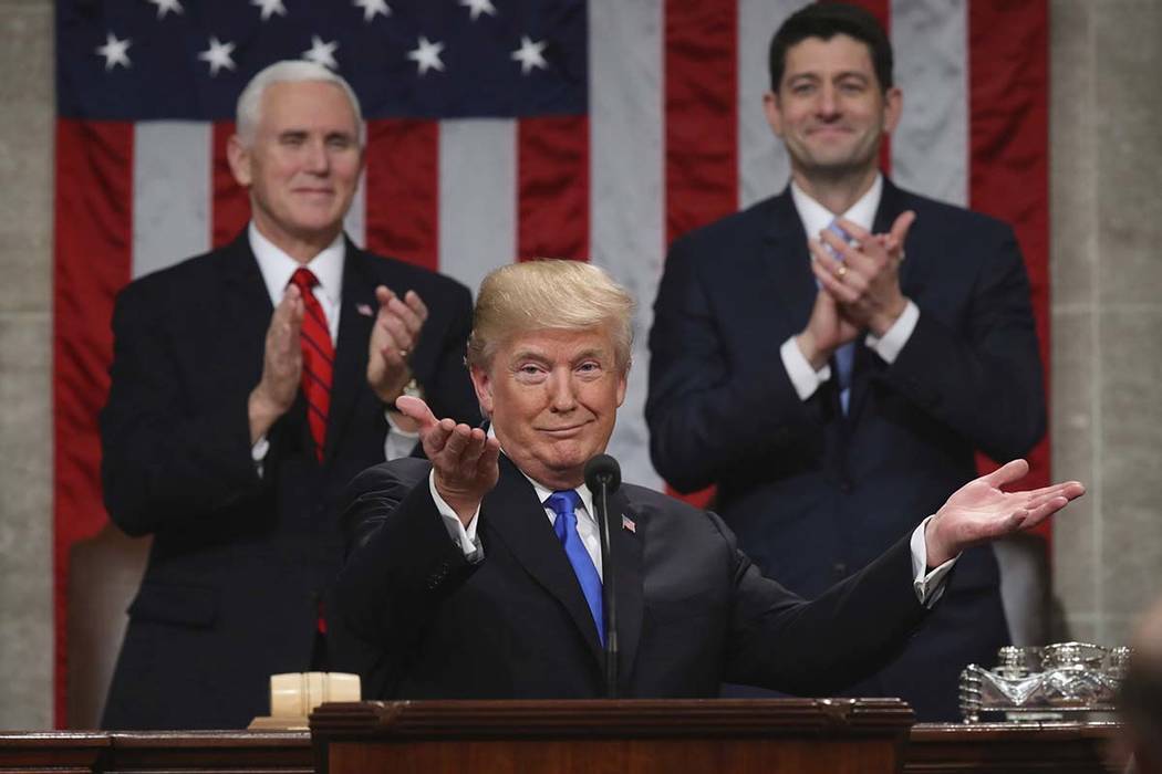 President Donald Trump gestures as delivers his first State of the Union address in the House chamber of the U.S. Capitol to a joint session of Congress Tuesday, Jan. 30, 2018 in Washington, as Vi ...