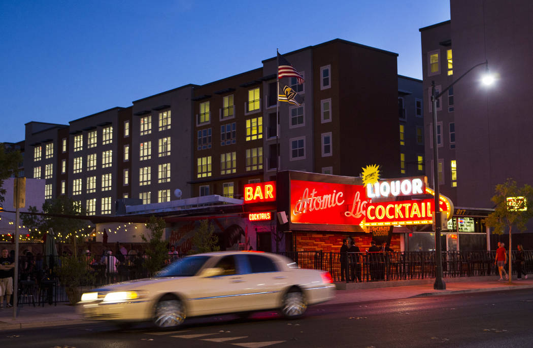 The Fremont9 apartment building, slated to open later this fall, rises above Atomic Liquors in downtown Las Vegas on Friday, June 22, 2018. Chase Stevens Las Vegas Review-Journal @csstevensphoto
