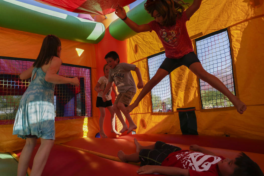 Kids jump around inside a bounce house at the City of Henderson's Fourth of July celebration at Heritage Park in Henderson, Tuesday, July 4, 2017. (Gabriella Angotti-Jones/Las Vegas Review-Journal ...