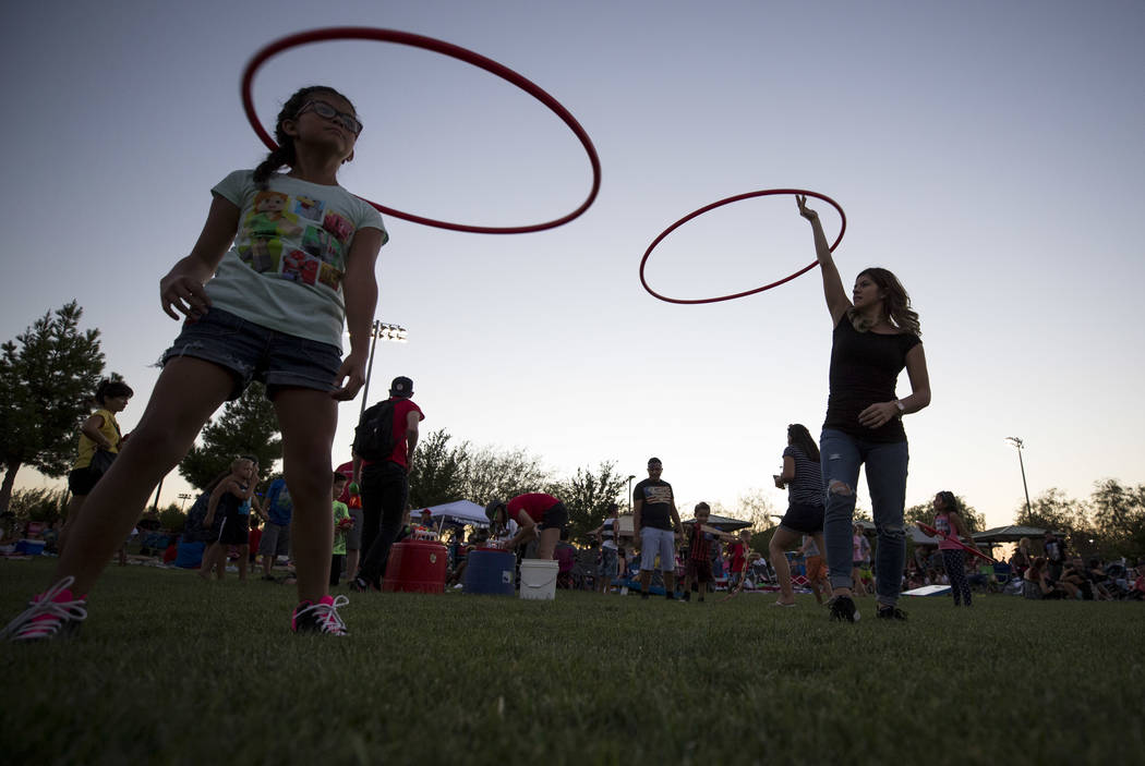 Brianna Hernandez, right, hula hoops with her 9-year-old daughter Julisa during Fourth of July festivities at Heritage Park on Tuesday, July 4, 2017 in Henderson. Richard Brian Las Vegas Review-Jo ...