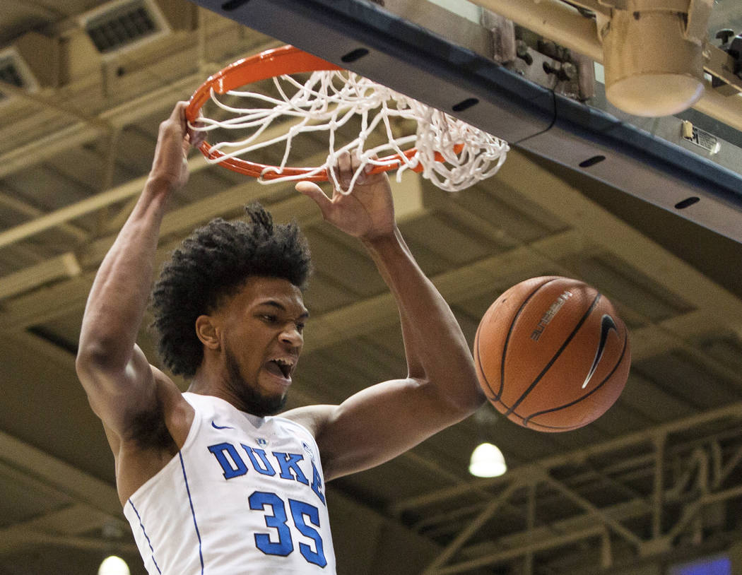 FILE - In this Jan. 27, 2018, file photo, Duke's Marvin Bagley III (35) dunks the ball during the first half of an NCAA college basketball game against Virginia in Durham, N.C. Marvin Bagley III d ...