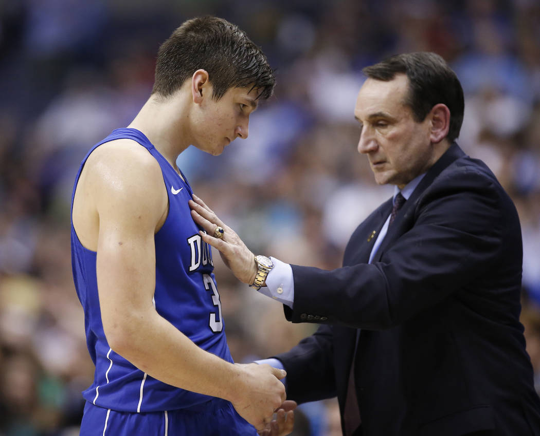 In this Thursday, March 10, 2016, photo, Duke guard Grayson Allen (3) and Duke head coach Mike Krzyzewski talk during the second half of an NCAA college basketball game in the Atlantic Coast Confe ...