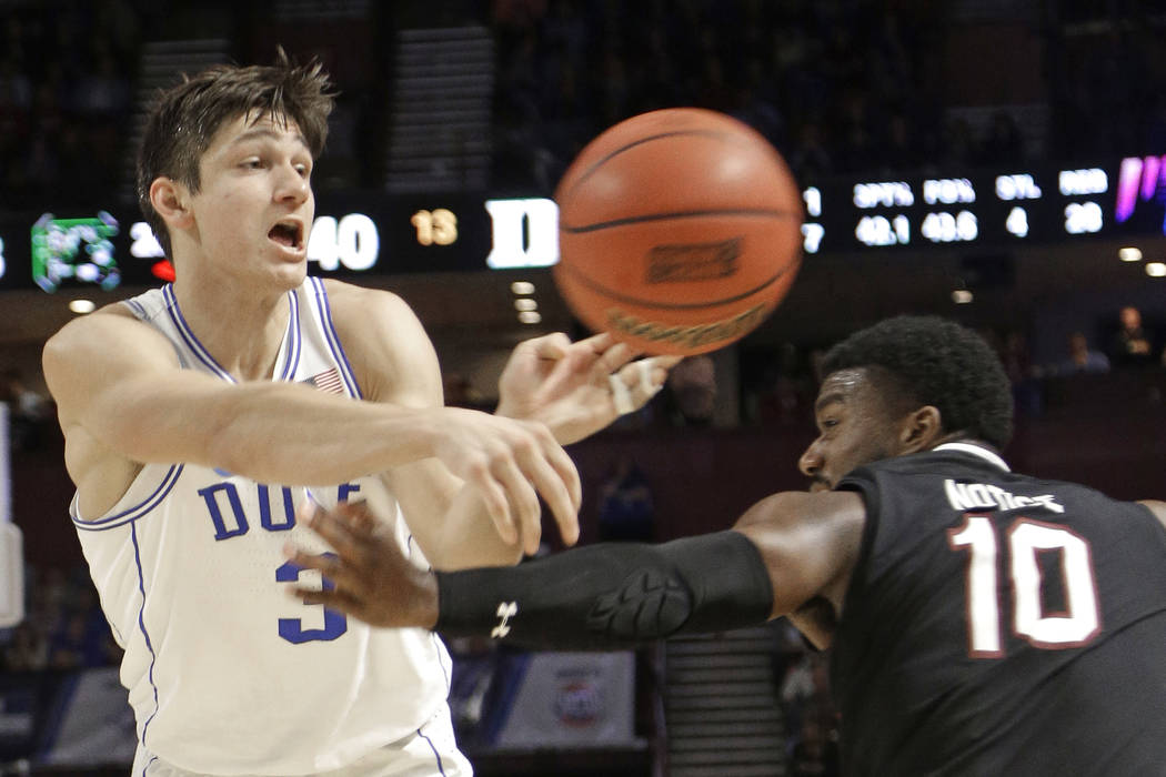 Duke's Grayson Allen (3) passes the ball as South Carolina's Duane Notice (10) defends during the second half in a second-round game of the NCAA men's college basketball tournament in Greenville, ...