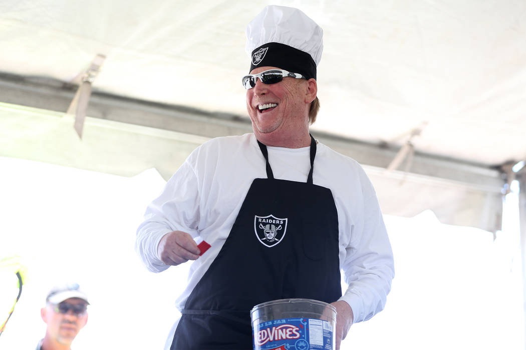 Oakland Raiders owner Mark Davis picks a raffle ticket for a giveaway during a barbecue for construction workers at the Raiders stadium site in Las Vegas, Thursday, June 28, 2018. Erik Verduzco La ...