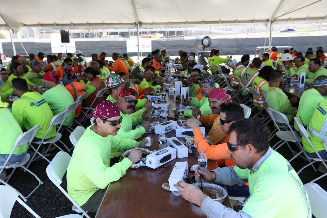 Construction workers eat lunch during a barbecue at the Raiders stadium site in Las Vegas, Thursday, June 28, 2018. Erik Verduzco Las Vegas Review-Journal @Erik_Verduzco