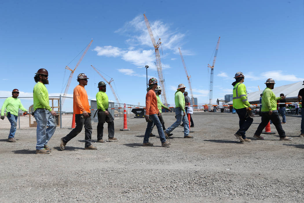 Construction workers make their way to a barbecue at the Raiders stadium site in Las Vegas, Thursday, June 28, 2018. Erik Verduzco Las Vegas Review-Journal @Erik_Verduzco