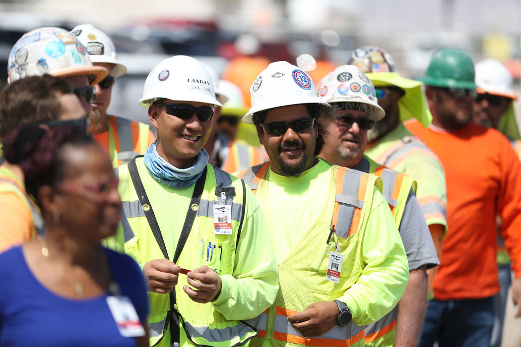 Construction workers lineup to eat during a barbecue at the Raiders stadium site in Las Vegas, Thursday, June 28, 2018. Erik Verduzco Las Vegas Review-Journal @Erik_Verduzco