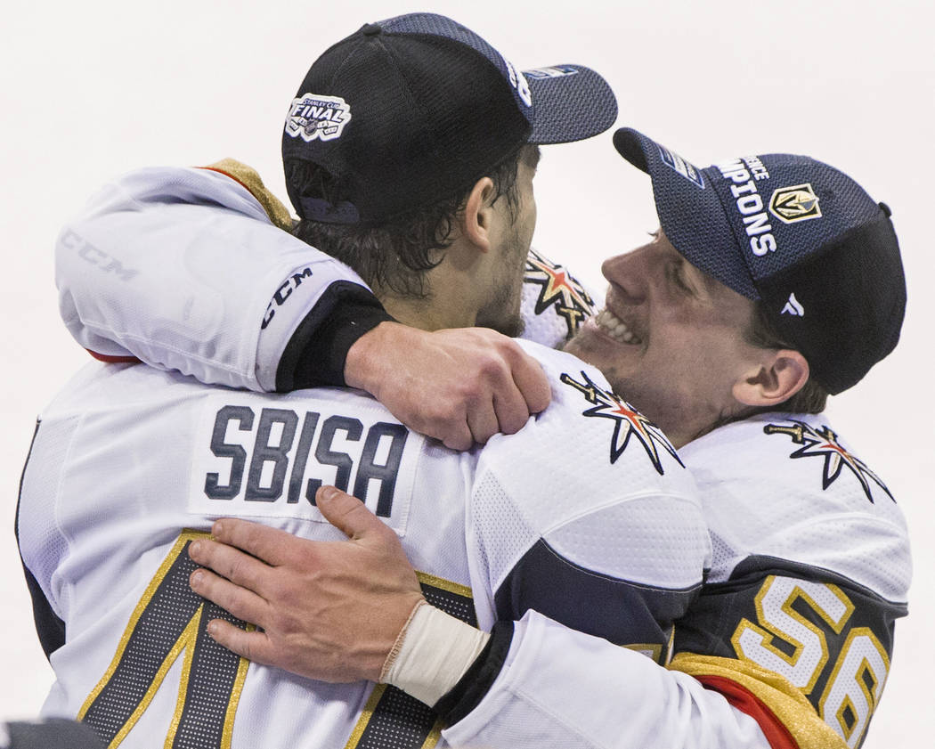 Golden Knights left wing Erik Haula (56) hugs teammate Luca Sbisa (47) after Las Vegas beat the Winnipeg Jets 2-1 to advance to the Stanley Cup Finals on Sunday, May 20, 2018, at Bell MTS Place, i ...