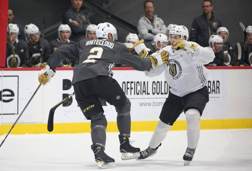 Vegas Golden Knights prospect Zach Whitecloud (2) defends Jonas Rondbejerg during scrimmage at Golden Knights development camp at City Center Arena on Friday, June 29, 2018, in Las Vegas. Bizuayeh ...