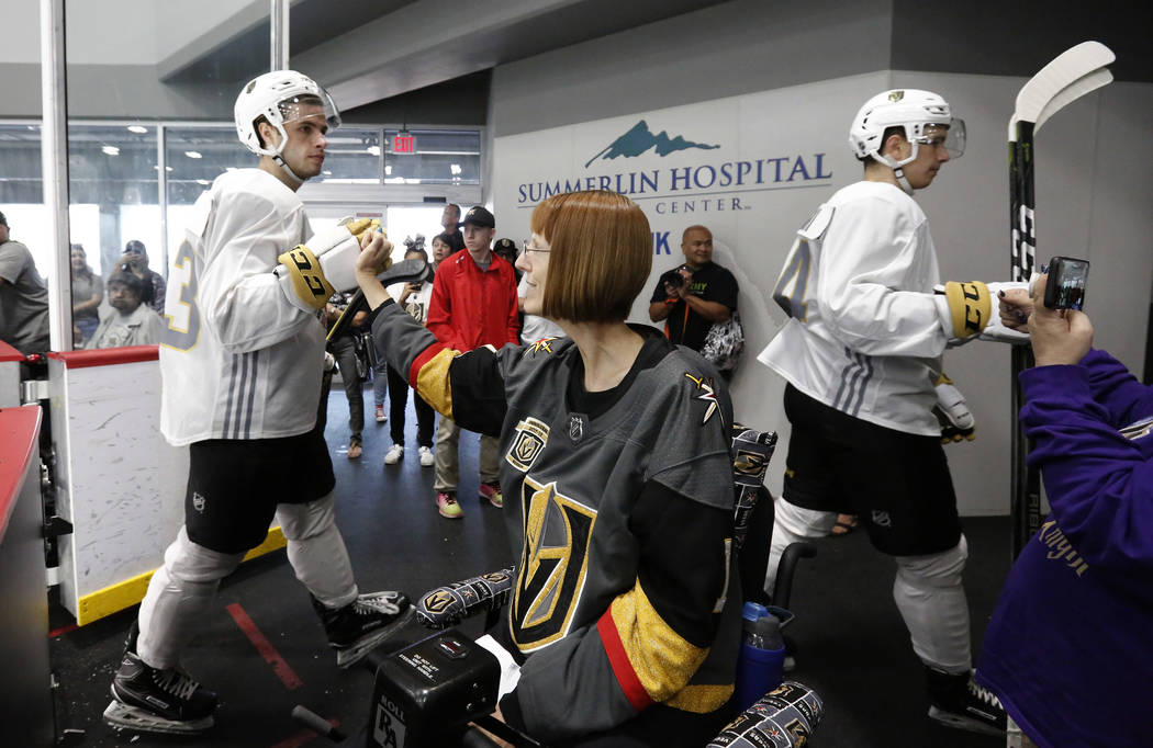 Vegas Golden Knights prospect Gage Quinney makes a fist bump Shannon Walker of Las Vegas after scrimmage at Golden Knights development camp at City Center Arena on Friday, June 29, 2018, in Las Ve ...