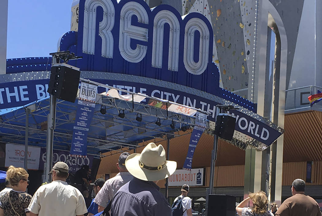 Visitors to the BBQ, Brews and Blues festival listen to a band in downtown Reno on June 16, 2018. The number of tourists visiting Reno-Sparks and Washoe County over the past year topped the 5 mill ...