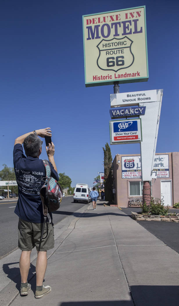 Tourists take photos of the signage at the Deluxe Inn Motel on Wednesday, May 16, 2018, in Seligman, AZ. Benjamin Hager Las Vegas Review-Journal @benjaminhphoto
