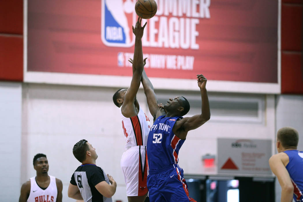 Chicago Bulls' Wendell Carter Jr. (34), and Detroit Pistons' Nnanna Egwu (52) jump for the ball at the start of the NBA Summer League game at Cox Pavilion in Las Vegas, Saturday, July 14, 2018. Er ...