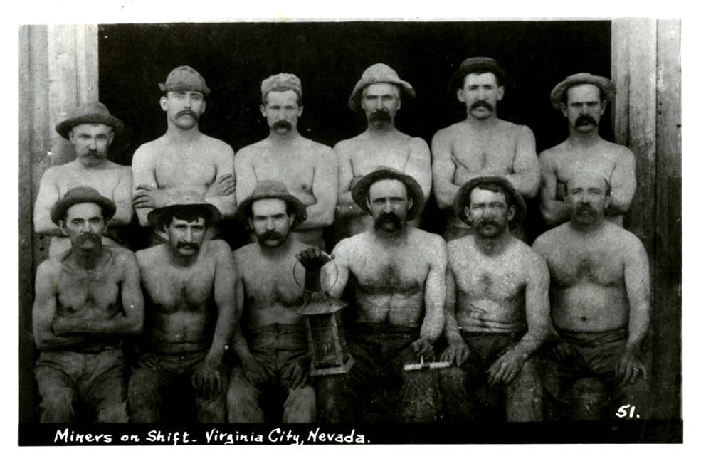 A group photograph of unidentified miners on shift in Virginia City, Nevada. Printed on the front of the card: "Miners on shift - Virginia City, Nevada." Original Collection Fred and Maurine Wi ...