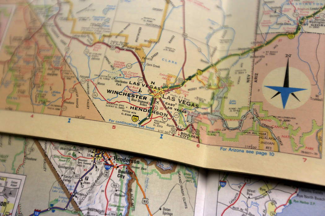 Old versions of Sate Farm Road Atlases, one from 1962 and one from 1968, at the Clark County Museum in Henderson on Monday, June 25, 2018. Hall-Patton is the Museum Administrator for the Clark Cou ...