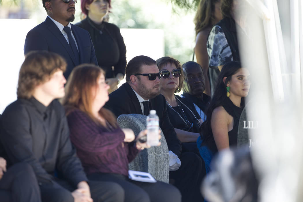 Reality television personality Corey Harrison, center, is surrounded by friends and family as he attends the funeral service of his grandfather, "Pawn Stars" patriarch, Richard Benjamin ...
