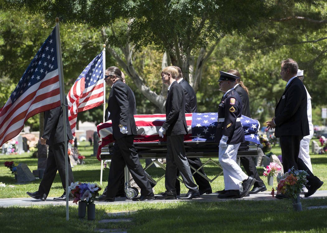 Pallbearers walk alongside the casket of "Pawn Stars" patriarch, Richard Benjamin Harrison, known as "The Old Man," at his funeral service at Palm Northwest Mortuary in Las Veg ...