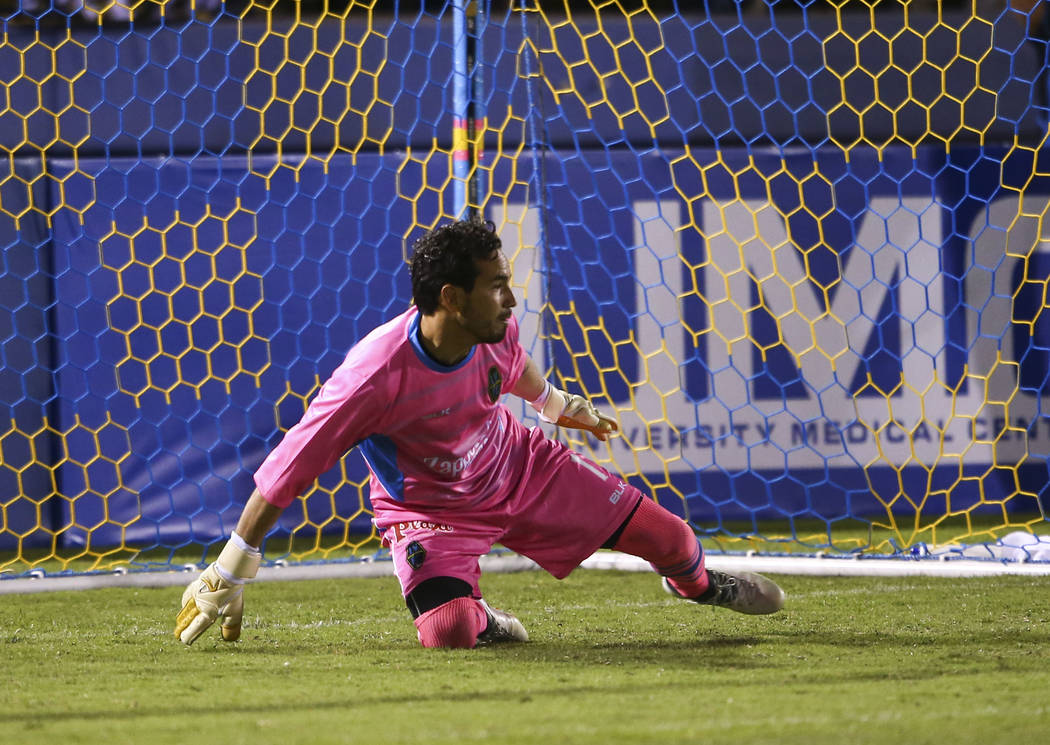 Las Vegas Lights FC goalkeeper Ricardo Ferriño (1) tries to block a shot from San Antonio FC during the second half of a United Soccer League game at Cashman Field in Las Vegas on F ...