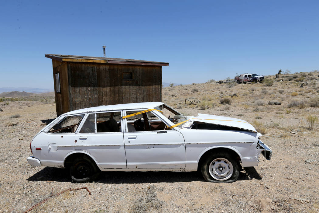 David Nehrbass, owner of Motor Sports Safety Solutions, rear, pulls up to a car that belonged t ...