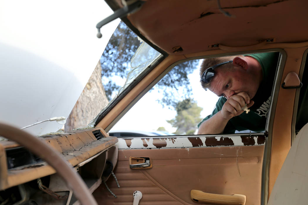 Michael Wiley Blackburn of Hartford, Wis. reacts to seeing a car that belonged to his father, t ...