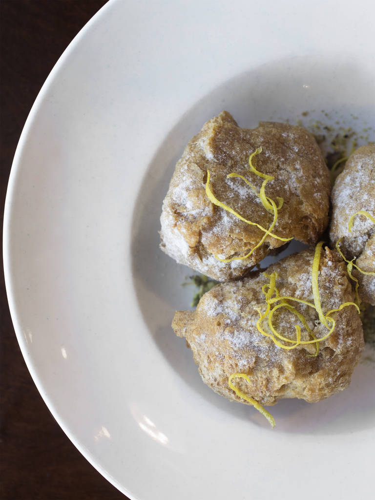 Sicilian doughnuts with sweetened ricotta, lemon zest and powdered sugar at Pizzeria Monzú on Monday, July 2, 2018, in Las Vegas. Benjamin Hager Las Vegas Review-Journal @benjaminhphoto