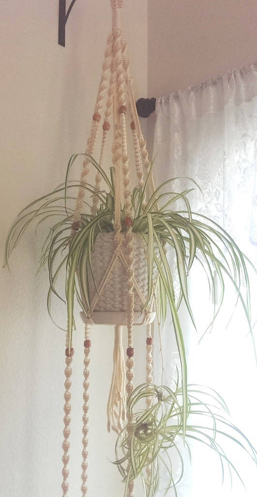 Macrame Market This hand-crafted macrame plant hanger is available through Etsy's Macrame Market.
