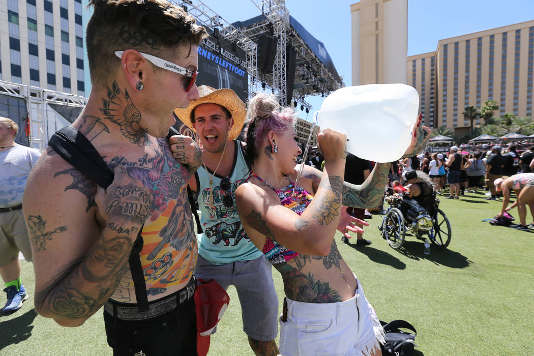Bobby Flannigan, from left, Curtis Isaacs and Gabriella Salcido stay cool during Warped Tour at Downtown Las Vegas Events Center on Friday, June 29, 2018. K.M. Cannon Las Vegas Review-Journal @KMC ...