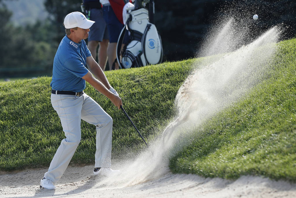 David Toms blasts out of a sand trap to put the ball on the 13th hole during the final round of the U.S. Senior Open golf tournament at The Broadmoor Sunday, July 1, 2018, in Colorado Springs, Col ...