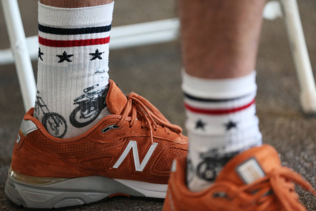 Travis Pastrana, professional motorsports competitor and stunt performer, wears Dare Devil socks, part of the Evel Knievel x Stance collection, during an interview at the Caesars Palace casino-hot ...