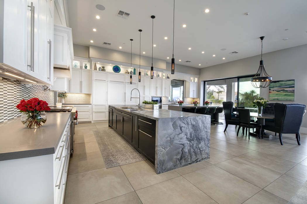 The kitchen has a second large island. (Sotheby’s International Realty)