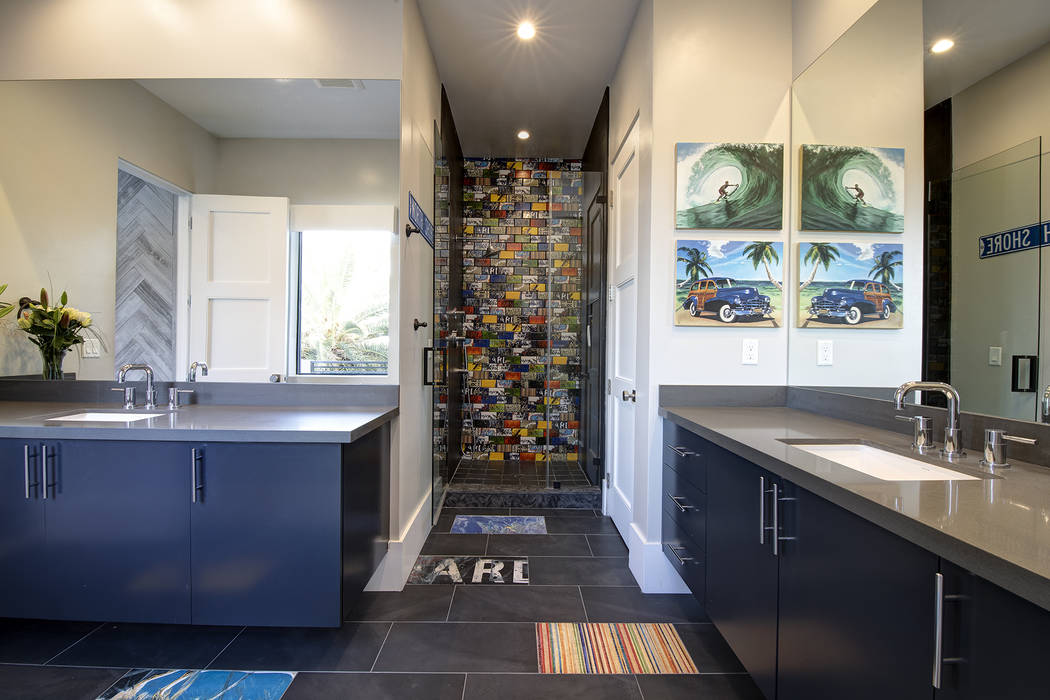 A secondary bath has colorful shower tile. (Sotheby’s International Realty)