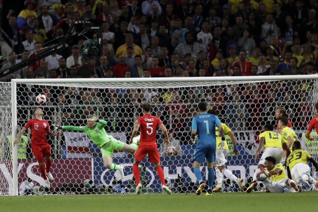 Colombia's Yerry Mina (13) scores his side's first goal during the round of 16 match between Colombia and England at the 2018 soccer World Cup in the Spartak Stadium, in Moscow, Russia, Tuesday, J ...