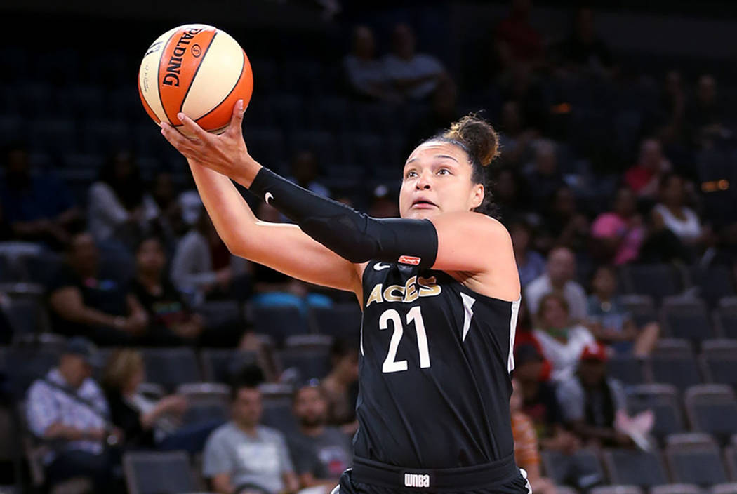 Las Vegas Aces guard Kayla McBride (21) pulls in a long pass in front of New York Liberty guard Sugar Rodgers (14) in the first half of a WNBA basketball game at the Mandalay Bay Events Center in ...